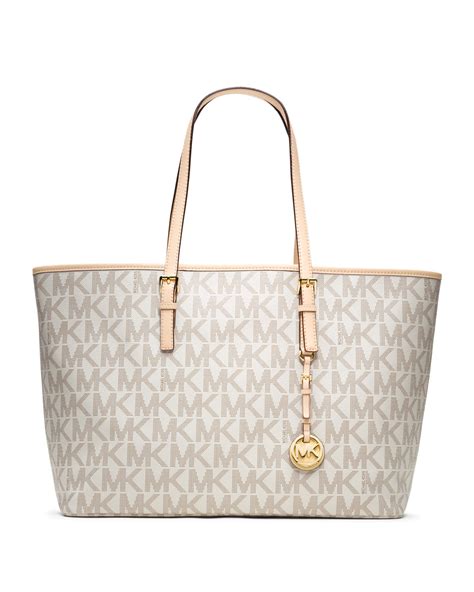 michael kors jet set travel logo medium multifunction tote|Michael Kors bag with airplanes.